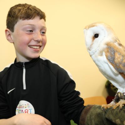 Picture of START winner with an owl. 